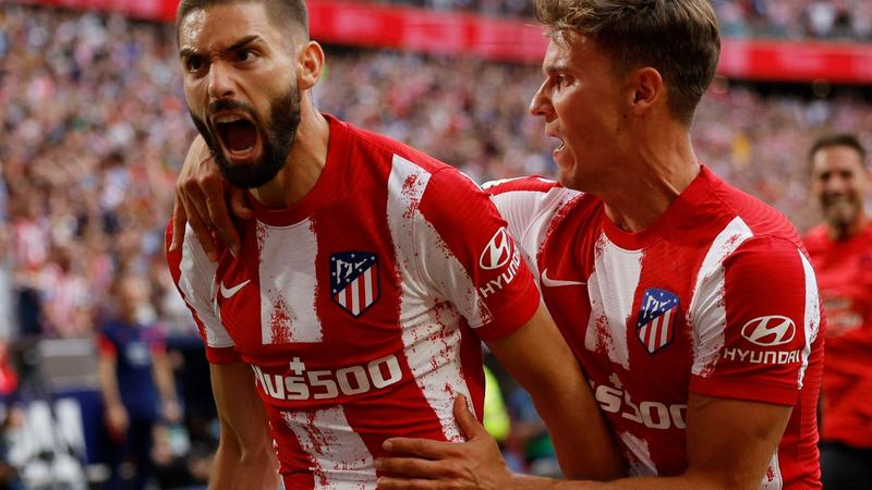 Carrasco scores late penalty to see 10-man Atletico past Espanyol